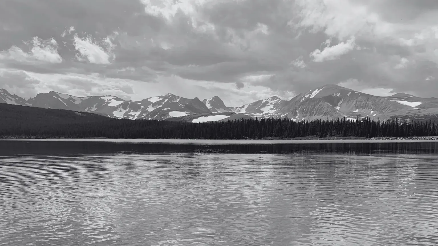 Snow-covered mountains and a lake in Colorado